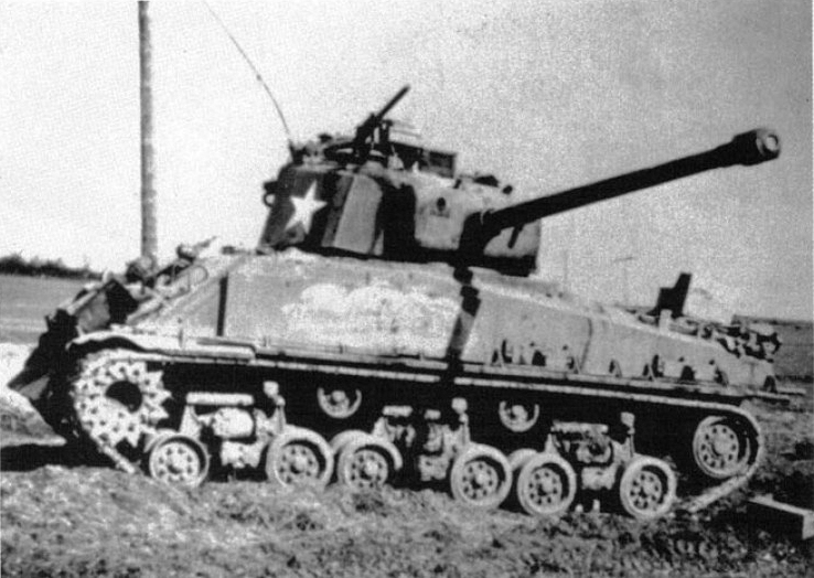 Tanks. Being tanks. - an Easy Eight M4A3E8 Sherman crossing railroad  tracks, with a bunch of logs laid on top of the tracks to made crossing  easier for the tank. This historical